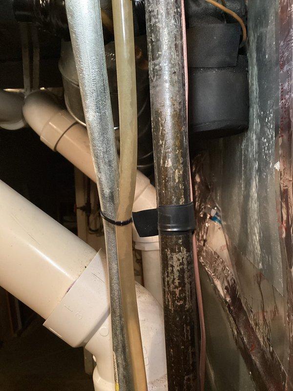 Completed annual heating tune-up on 15-year-old ENERGI system with humidifier. Inspected furnace components and observed deterioration of metal exhaust pipes with visible corrosion and surface staining. Examined copper piping with brass fittings and verified proper function of circulation pump and electrical connections.