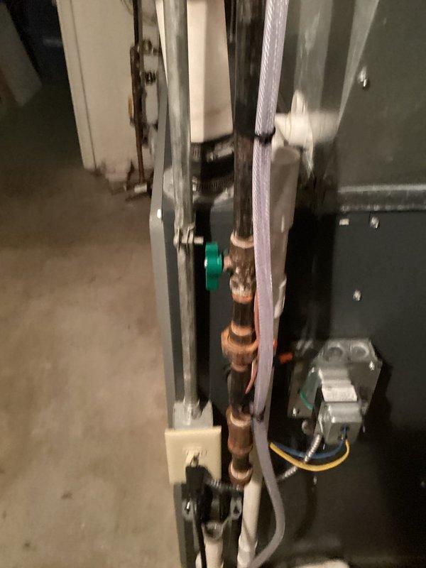 Completed annual heating tune-up on 15-year-old ENERGI system with humidifier. Inspected furnace components and observed deterioration of metal exhaust pipes with visible corrosion and surface staining. Examined copper piping with brass fittings and verified proper function of circulation pump and electrical connections.