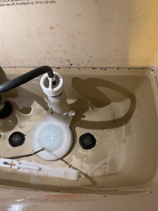 Responded to service call for toilet with continuous running water and handle operation issues. Upon inspection, adjusted flush valve assembly and flapper to correct water running problem. Repaired handle linkage mechanism to eliminate need to hold handle down during flush cycle. Tested operation multiple times to ensure proper function and water shutoff.