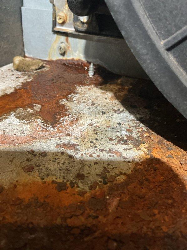 Performed annual heating maintenance on 15-year-old Goodman furnace. Documented significant rust and corrosion on heat exchanger and base plate with evidence of moisture accumulation. Recommended replacement due to safety concerns as unit is beyond expected service life.