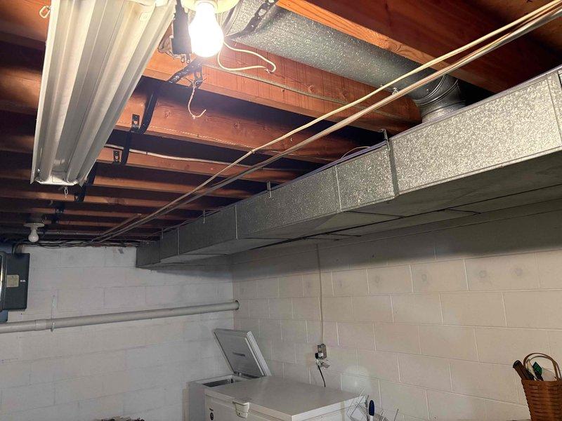 Responded to no-heat complaint on 11-day-old warranty furnace that would not engage despite customer reset attempts. Upon inspection of the basement utility area, identified and corrected issue with the furnace ignition system, restoring proper heating function to the unit.