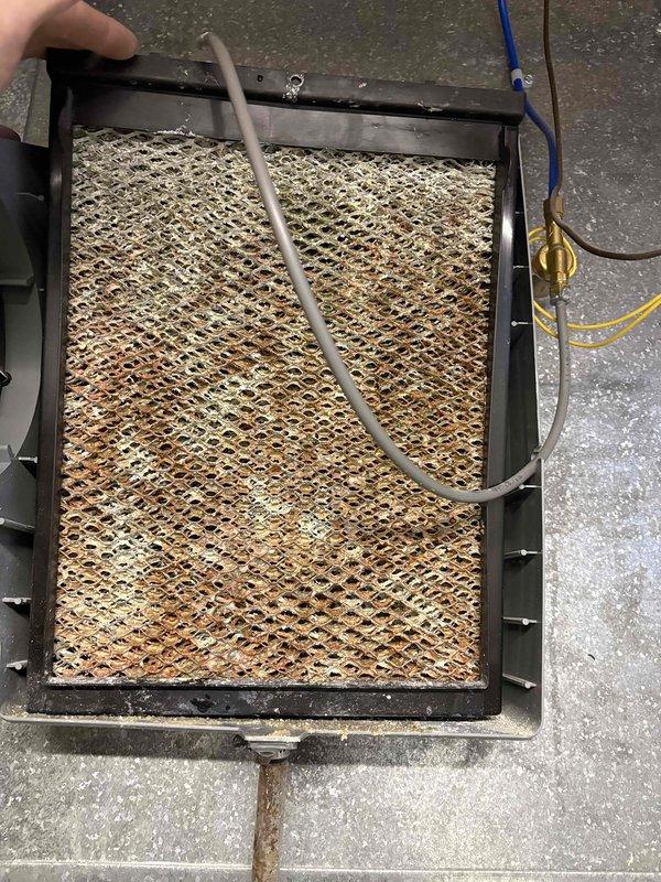 Completed FSTU on 12-year-old furnace, including inspection and cleaning of the air filter assembly. Examined the Aprilaire filtration system which showed signs of normal wear, and verified the system's 96.0 energy efficiency rating as indicated on the Energy Guide label. All components are now functioning properly after service.