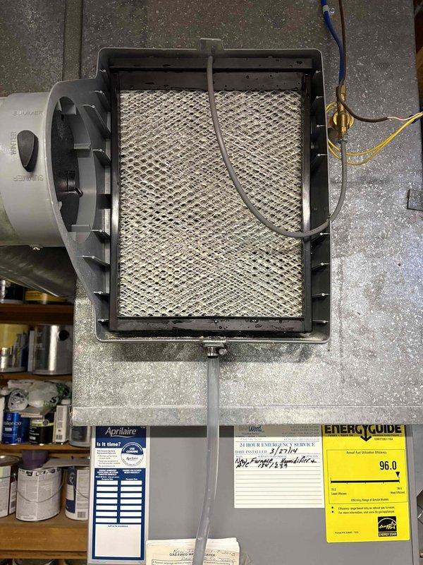 Completed FSTU on 12-year-old furnace, including inspection and cleaning of the air filter assembly. Examined the Aprilaire filtration system which showed signs of normal wear, and verified the system's 96.0 energy efficiency rating as indicated on the Energy Guide label. All components are now functioning properly after service.