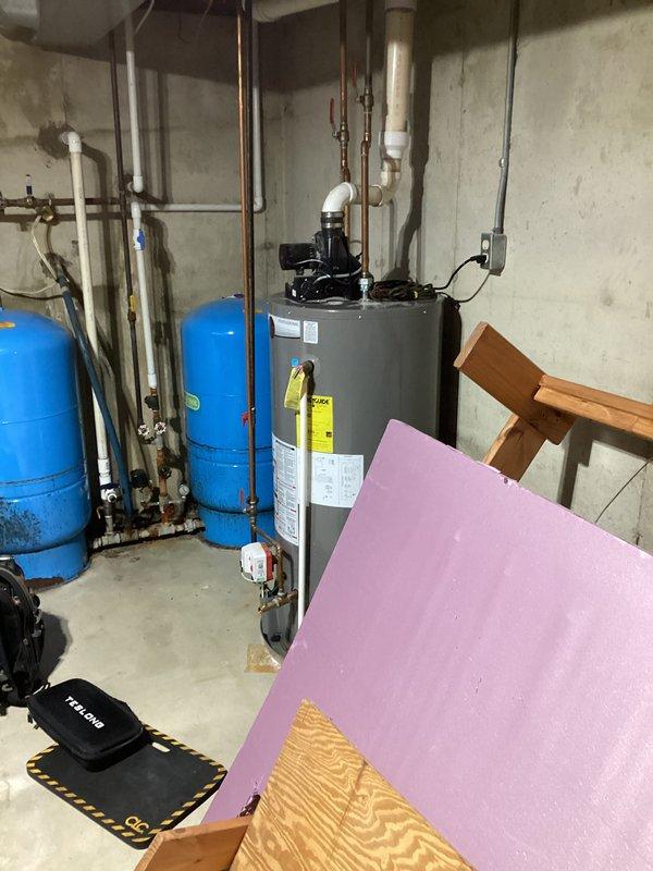 Responded to service call for 9-year-old Rheem water heater leaking from the top area while still providing hot water. Upon inspection, identified deteriorated fittings at the cold water inlet connection as the source of the leak. Replaced affected fittings and performed pressure test to confirm repair was successful, restoring system to proper operation with no further leakage.