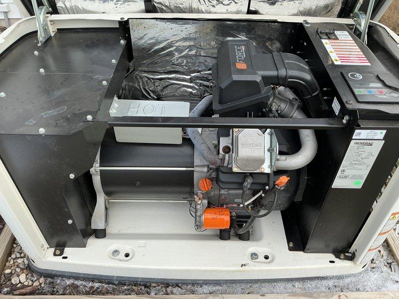 Conducted scheduled 5-year tune-up service on Generac generator system. Inspected engine components including oil filter, fuel connections, and air intake assembly, noting minor surface corrosion on exhaust piping but confirming overall system functionality. Completed preventative maintenance according to manufacturer specifications with photographic documentation of work performed.