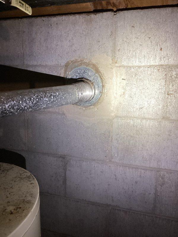 Inspected basement flooding in storage room area where water had been accumulating for four days. Identified water intrusion around pipe penetration through concrete block wall and moisture accumulation around water heater base. Determined that installation of a sump pump system would be the appropriate solution for ongoing water management in this 30+ year old home.