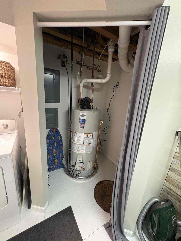 Successfully installed a new 50-gallon power-vent natural gas water heater with proper PVC venting connections. Removed existing saddle valve for humidifier on hot outlet and replaced with new quarter-turn compression stop. System was properly connected to electrical outlet and all connections were tested to ensure proper operation.
