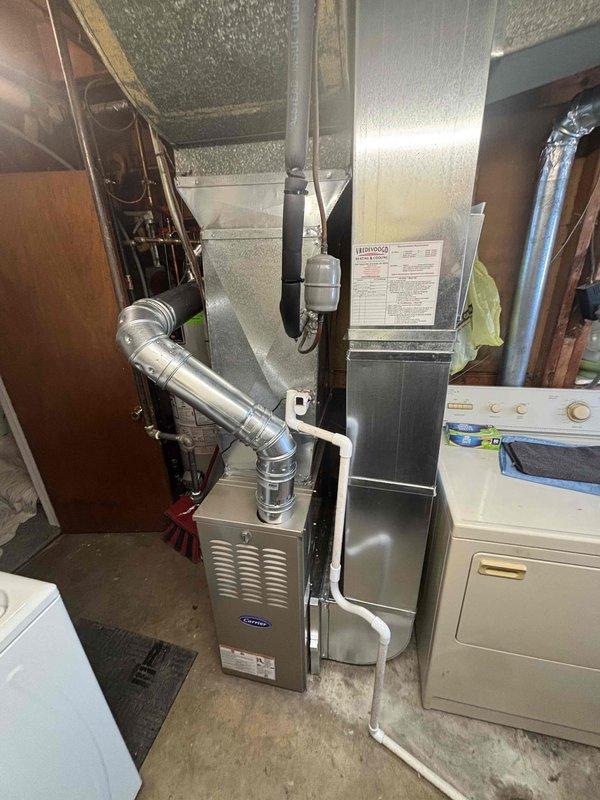 Successfully completed installation of Carrier furnace system with proper venting and ductwork connections. System was verified to be functioning correctly with all required safety features in place. All old equipment was removed and the new installation meets current code requirements.