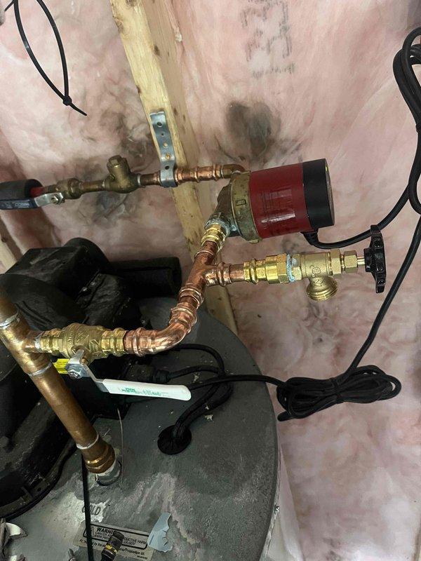 Successfully completed quoted repair of water heater pipe leak. Installed new copper piping with brass fittings and valves to resolve the issue, and reconnected the circulation pump to restore proper system function. All connections were tested and confirmed leak-free.