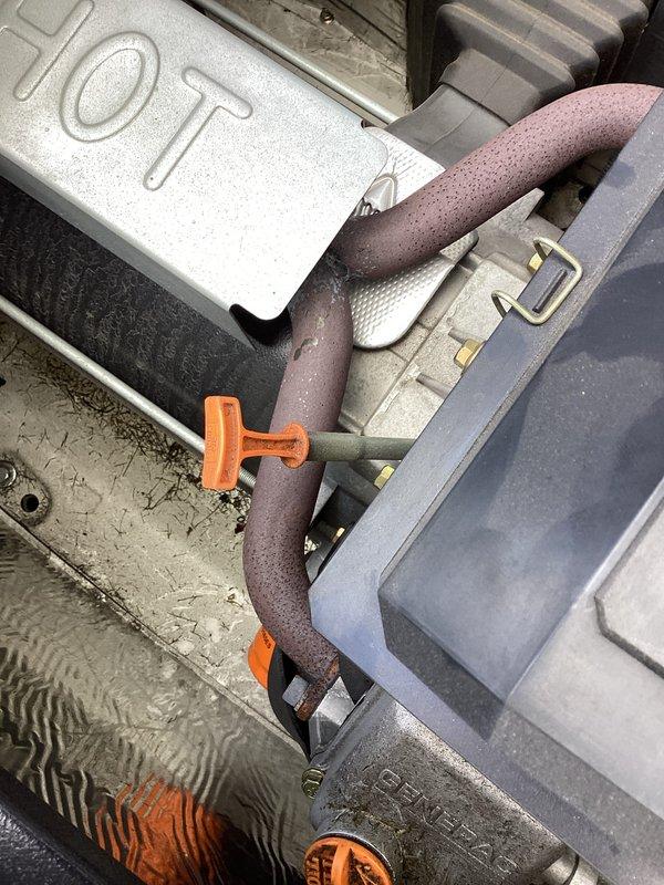 Performed scheduled generator tune-up on Generac unit. Replaced genuine Generac oil filter and completed standard maintenance procedures. Noted significant dirt and debris accumulation around base of unit requiring cleanup. No issues found with the insulated plumbing connections or hot water components.