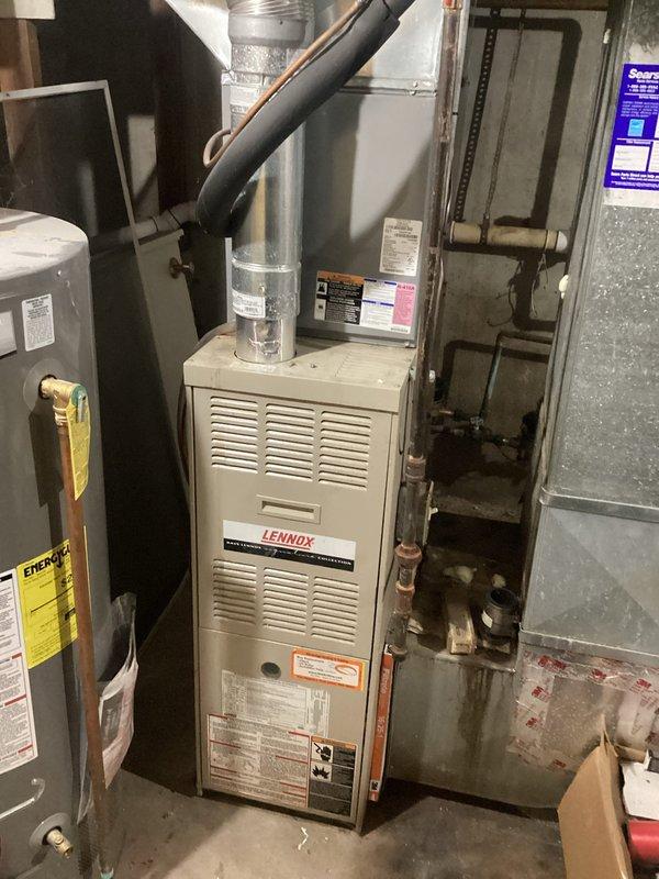 Responded to no heat complaint for a Lennox furnace system. Diagnosed issue and restored heat functionality. System is now operating properly with normal airflow through ductwork and proper connection to the adjacent Rheem Professional water heater.