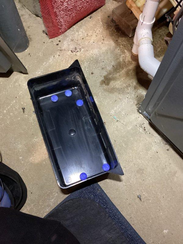 Performed annual heating service on 8-year-old EnergiAir furnace (model WT 03-2028). Discovered stagnant water with debris in the condensate drain pan and documented with photos. Applied drain tablets to prevent future clogging and inspected humidifier operation. System is now functioning properly with improved drainage.