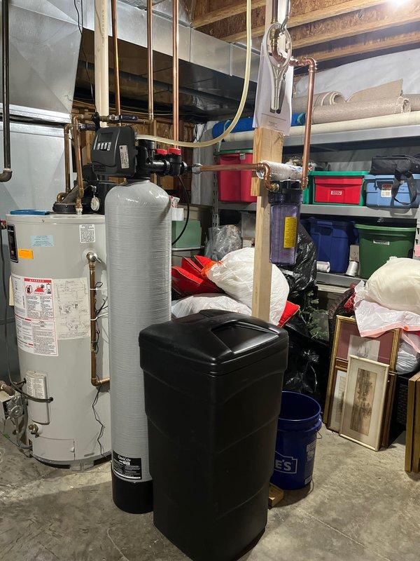 Successfully completed the quoted water softener replacement in the basement utility area. Removed the existing black water softener unit and installed new system, ensuring proper connection to existing copper plumbing lines. Tested system functionality and confirmed proper operation before completing the service.