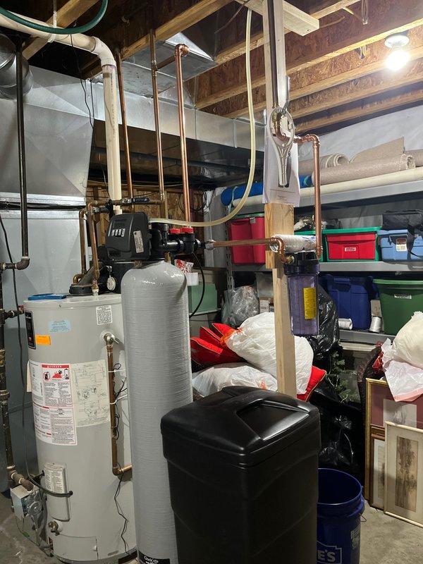Successfully completed the quoted water softener replacement in the basement utility area. Removed the existing black water softener unit and installed new system, ensuring proper connection to existing copper plumbing lines. Tested system functionality and confirmed proper operation before completing the service.