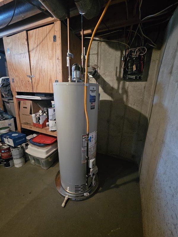Successfully installed new Ameristar furnace with proper PVC venting system and drain pan in basement mechanical room, along with replacement water heater featuring appropriate piping connections. Both units were properly connected to existing ductwork and plumbing systems, with all safety checks completed and system functionality verified.