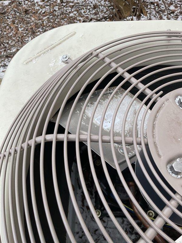 Responded to no-cooling service call to find outdoor AC unit severely damaged by fallen icicle. Unit installed on wooden deck showed visible frost accumulation on components. After thorough inspection, determined unit requires replacement rather than repair due to extent of damage. Documented condition with photos for insurance claim purposes.