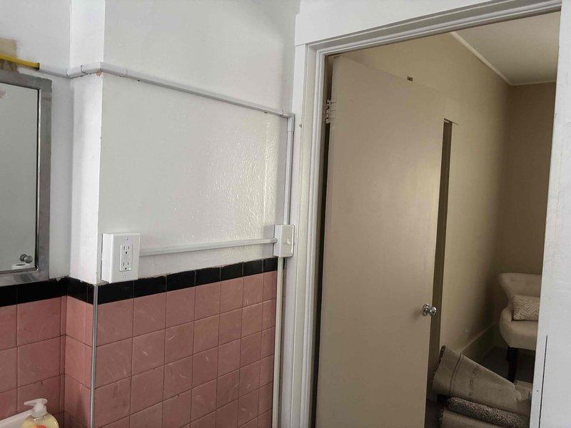 Installed new GFCI outlet in bathroom with aging tile work, replacing older electrical components while maintaining proper connections to existing wiring system. The installation enhances electrical safety in the moisture-prone area and brings the fixture up to current code requirements.