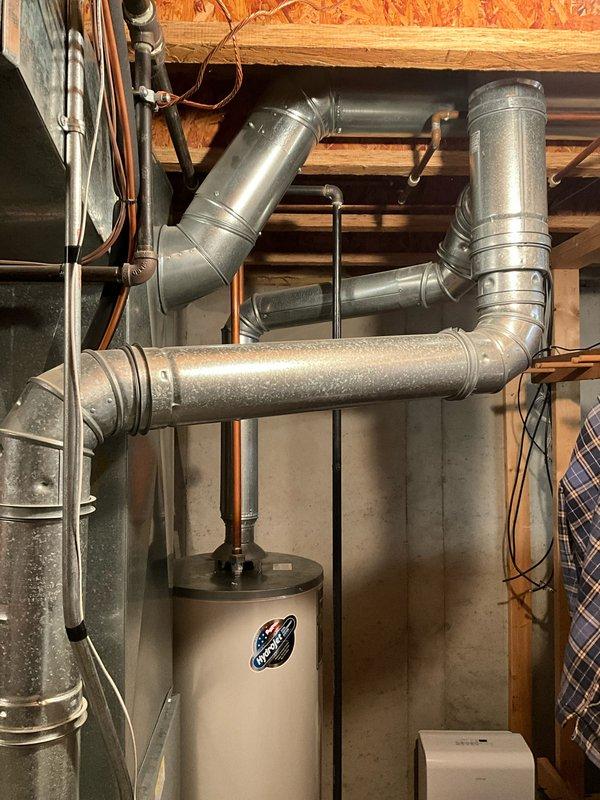 Performed comprehensive FSTU on 21-year-old Carrier furnace, including cleaning components, checking connections, and verifying proper operation. System is functioning efficiently with no immediate concerns. Also conducted visual inspection of aging water heater for potential replacement consideration.