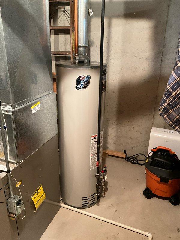Performed comprehensive FSTU on 21-year-old Carrier furnace, including cleaning components, checking connections, and verifying proper operation. System is functioning efficiently with no immediate concerns. Also conducted visual inspection of aging water heater for potential replacement consideration.