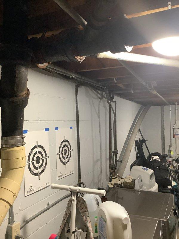 Conducted an on-site assessment of residential property for water softener installation quote. Inspected basement utility area with exposed plumbing infrastructure, documenting current water system configuration and available space for new equipment. Photos taken of installation area show proximity to existing laundry appliances and mechanical systems for proper integration planning.