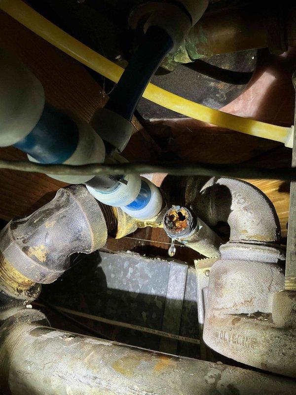 Responded to a service call for a minor water line leak in basement. Upon inspection, identified dripping at a corroded joint connection on aging metal pipes. Repaired the leaking fitting and verified proper operation of associated valves and connections in the plumbing system.