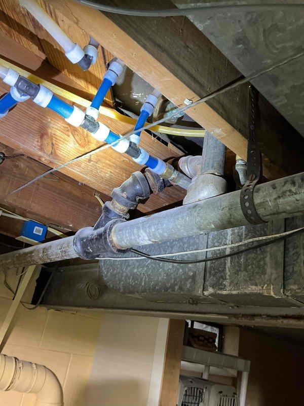 Responded to a service call for a minor water line leak in basement. Upon inspection, identified dripping at a corroded joint connection on aging metal pipes. Repaired the leaking fitting and verified proper operation of associated valves and connections in the plumbing system.