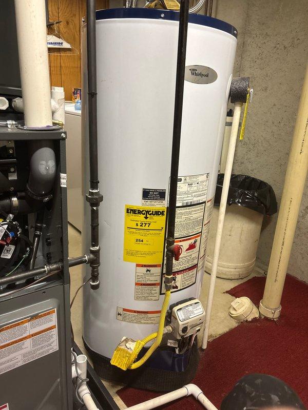 Completed annual heating maintenance service on Whirlpool water heating system. Performed full tune-up of furnace components and inspected all connections, ducting, and ventilation. No humidifier issues noted; system is functioning properly with all PVC and copper piping in good condition.