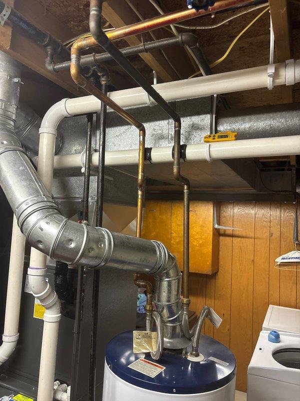 Completed annual heating maintenance service on Whirlpool water heating system. Performed full tune-up of furnace components and inspected all connections, ducting, and ventilation. No humidifier issues noted; system is functioning properly with all PVC and copper piping in good condition.