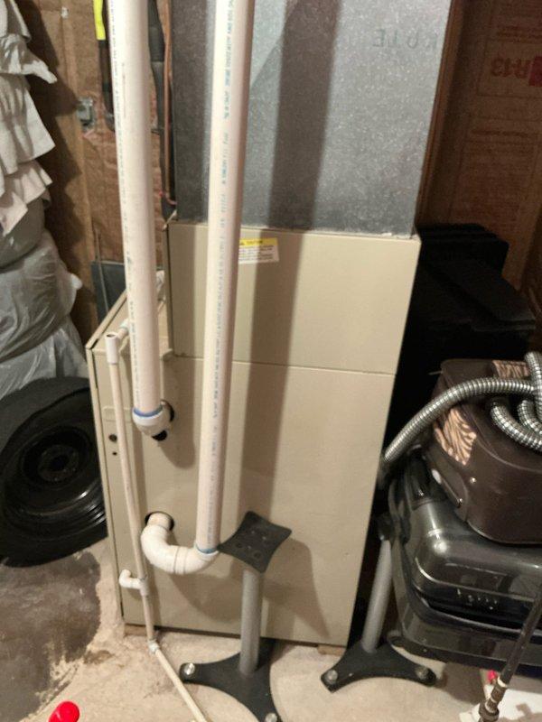 Completed estimate for replacement of 16-year-old Bryant furnace and AC system. Documented existing installation in basement utility area, including current furnace with PVC venting, ductwork configuration, and adjacent mechanical equipment. Photos taken of the complete system to support replacement proposal.