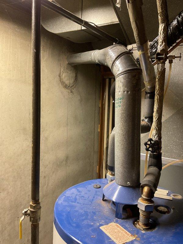 Completed Annual Heating Tune-Up on EnergiAir furnace, model WT 07-2035. Documented visible condensation and efflorescence on HVAC ductwork in utility area with potential moisture issues. No humidifier present; system is approximately 0 years old with clean mechanical components.