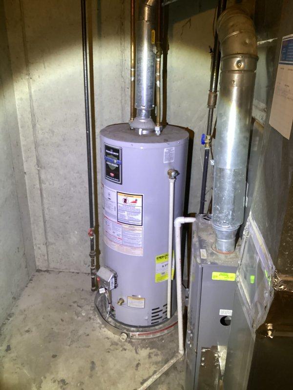 Responded to no-heat call for 10-year-old Ruud system that was turning on briefly before shutting off. Inspection of the furnace and water heater installation in basement utility room revealed proper venting configuration with no visible issues. Verified all connections to ensure proper ventilation of combustion gases. System was restored to normal operation.