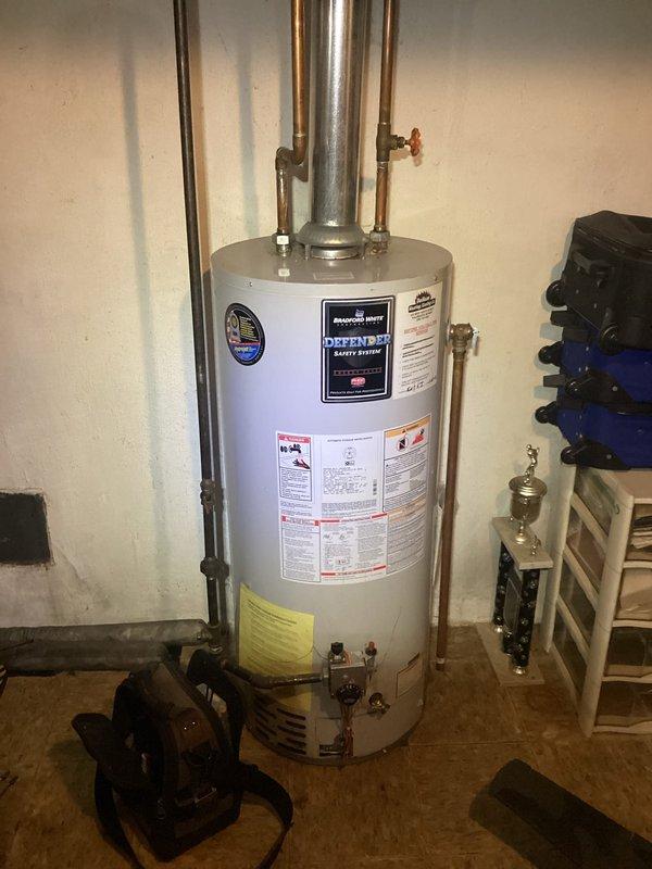 Completed annual heating tune-up on 11-year-old EnergiAir furnace system. Observed significant corrosion and rust along the bottom edge of the furnace cabinet that requires monitoring. Water heater (Defender model) was also inspected and appears to be functioning properly with no immediate concerns.