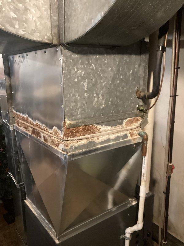 Completed annual heating tune-up on 11-year-old EnergiAir furnace system. Observed significant corrosion and rust along the bottom edge of the furnace cabinet that requires monitoring. Water heater (Defender model) was also inspected and appears to be functioning properly with no immediate concerns.