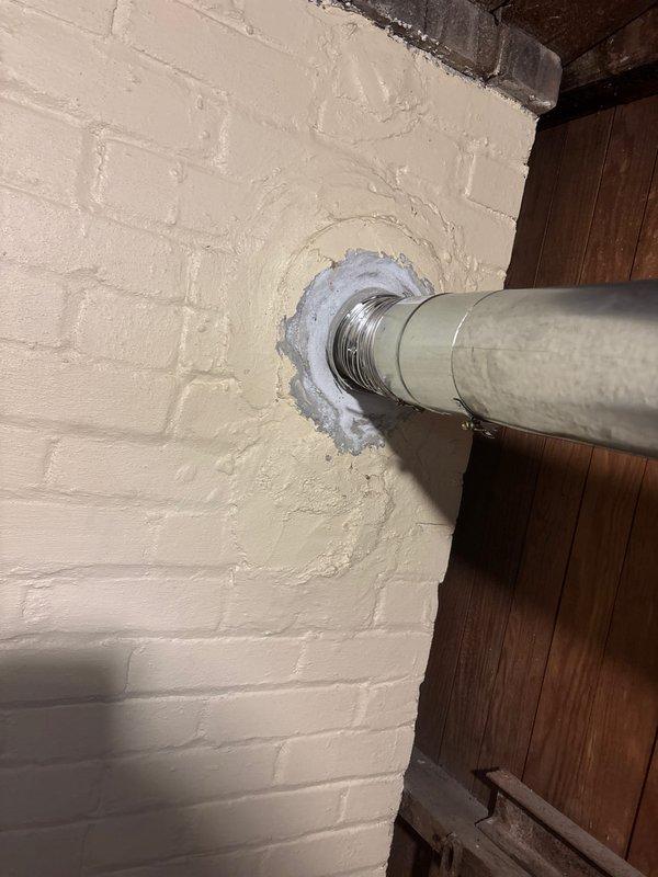 Successfully installed a 40-gallon natural gas water heater with proper venting through the exterior wall. Completed all necessary water and gas line connections, and sealed the vent penetration with appropriate caulking to ensure proper sealing. Unit was tested and confirmed to be functioning correctly before completion.