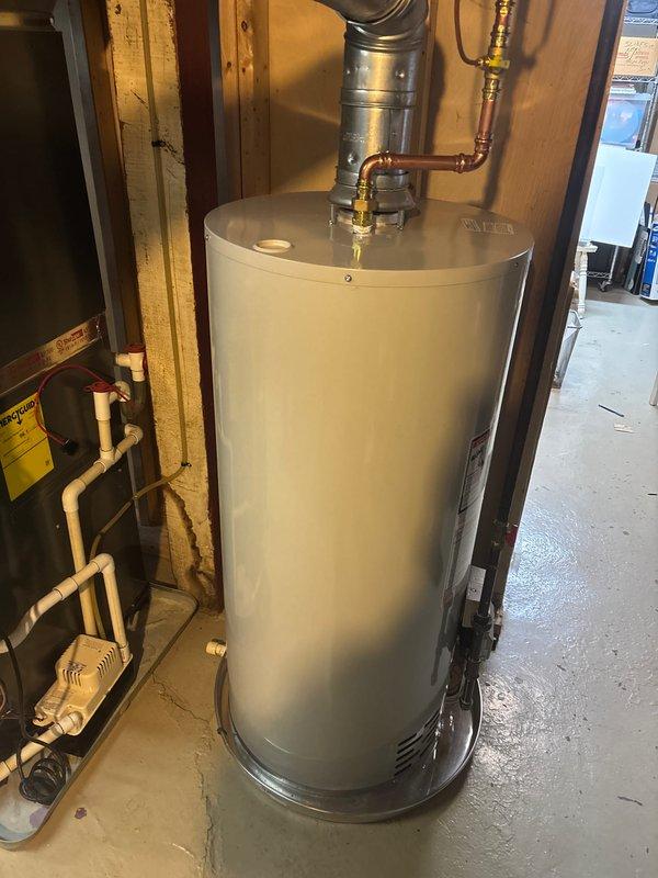 Successfully installed a 40-gallon natural gas water heater with proper venting through the exterior wall. Completed all necessary water and gas line connections, and sealed the vent penetration with appropriate caulking to ensure proper sealing. Unit was tested and confirmed to be functioning correctly before completion.