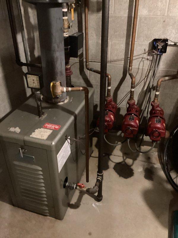 Diagnosed water heater malfunction in basement mechanical room, identifying issue with one of three red circulator pumps in the hydronic heating system. Repaired faulty pump connections and tested water heater operation, confirming proper functionality of the complete system including ventilation components.