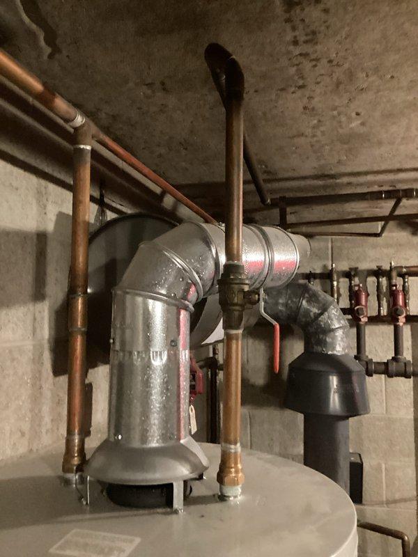 Diagnosed water heater malfunction in basement mechanical room, identifying issue with one of three red circulator pumps in the hydronic heating system. Repaired faulty pump connections and tested water heater operation, confirming proper functionality of the complete system including ventilation components.