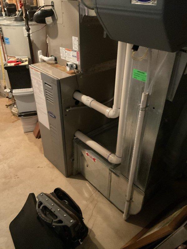 Diagnosed airflow issue on 21-year-old Carrier furnace that was blowing cold air. Inspection revealed faulty blower motor capacitor causing improper operation. Replaced capacitor and verified proper temperature rise and system operation across all zones.