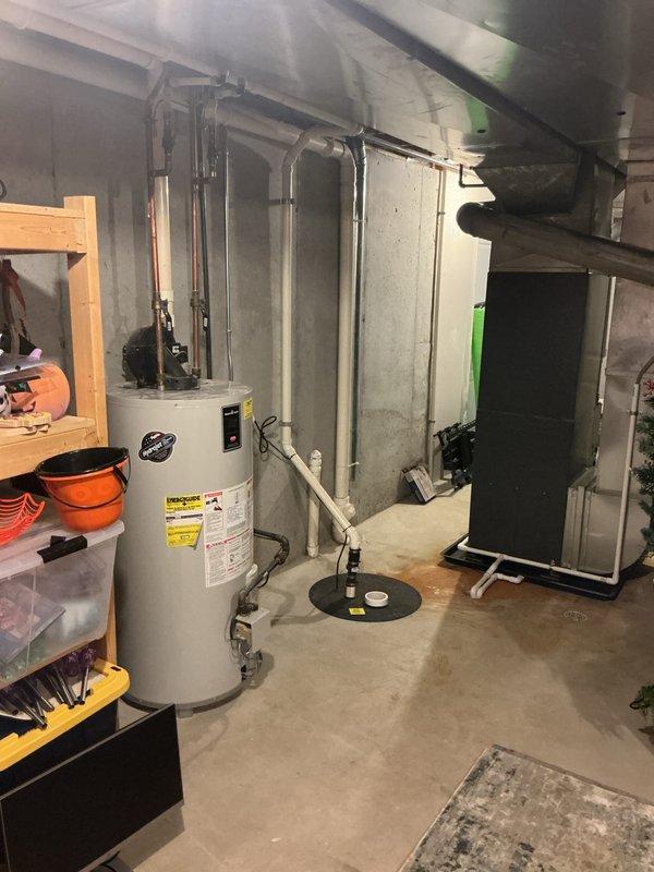 Completed annual heating system maintenance on an EnergiAir furnace (model WT 06-2034). Performed standard tune-up procedures on the unit located in the basement utility area adjacent to water heater and plumbing infrastructure. System includes humidifier which was inspected and found to be functioning properly.