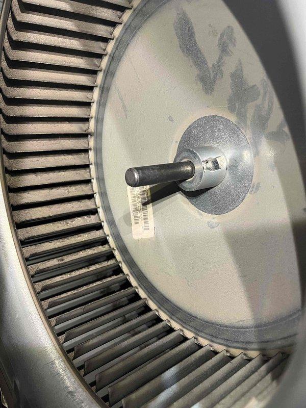 Performed annual heating maintenance on 23-year-old Rheem furnace. Inspected and cleaned blower wheel which showed moderate dust accumulation. Checked and adjusted mechanical components including the drive shaft assembly. System operating properly with no humidifier present.
