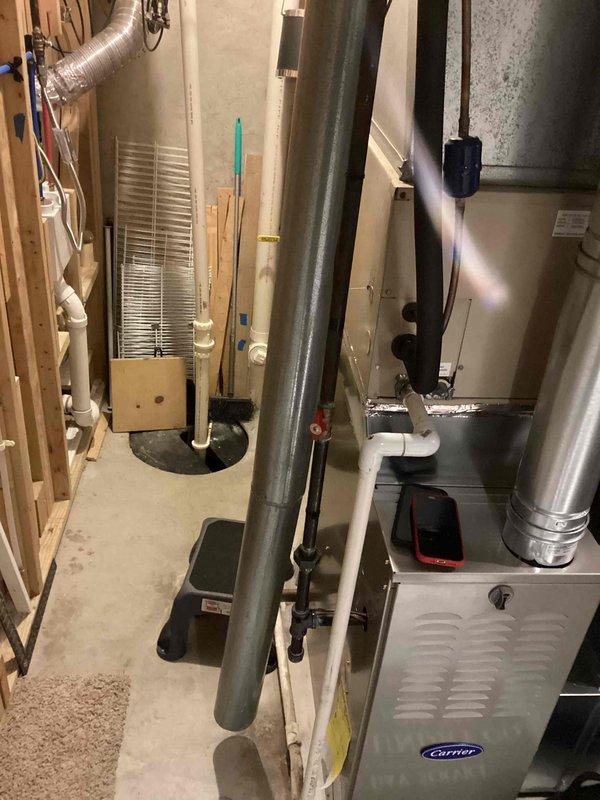 Performed annual heating maintenance on Carrier furnace (model 08-2035, manufactured 2011). Inspected ductwork connections and metal strapping, noting satisfactory condition of the flexible metallic ductwork and PVC ventilation pipes. System is functioning properly with no operational issues detected.