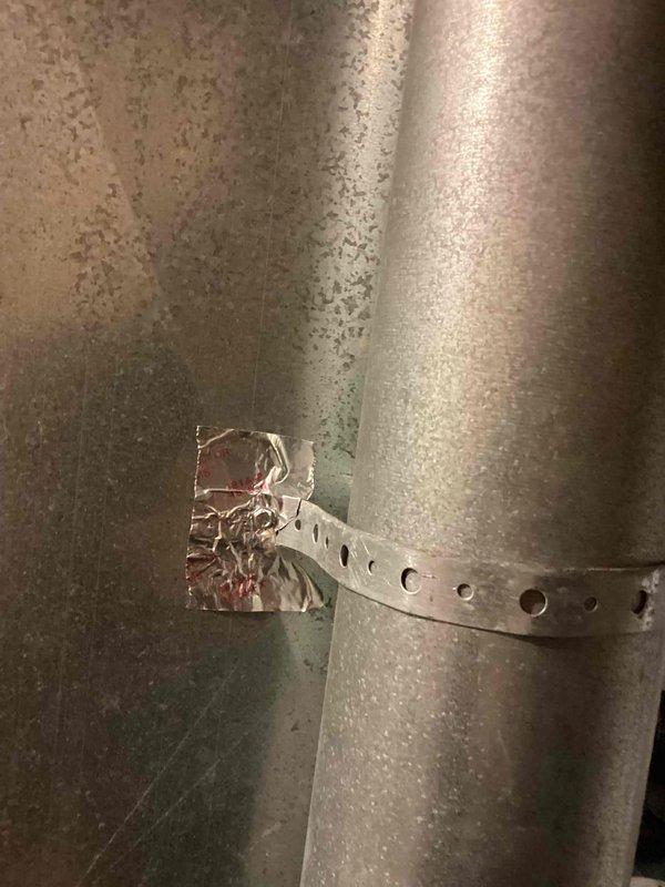 Performed annual heating maintenance on Carrier furnace (model 08-2035, manufactured 2011). Inspected ductwork connections and metal strapping, noting satisfactory condition of the flexible metallic ductwork and PVC ventilation pipes. System is functioning properly with no operational issues detected.