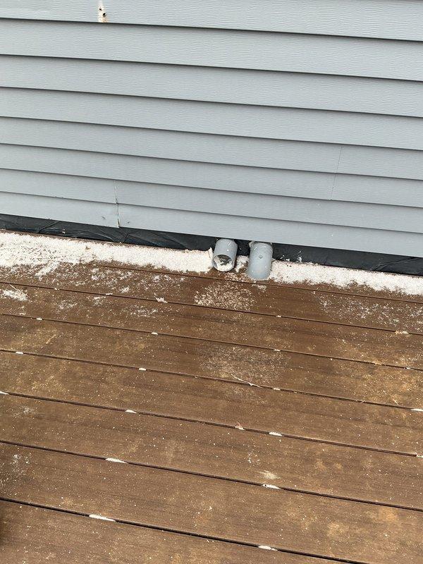 Inspected exterior vent pipe configuration where two PVC pipes currently protrude through the siding at deck level. Evaluated options for relocating HVAC ventilation to accommodate client's deck renovation project. Documented current installation with photographs to develop proper venting solution that will maintain code compliance while allowing for new deck construction.