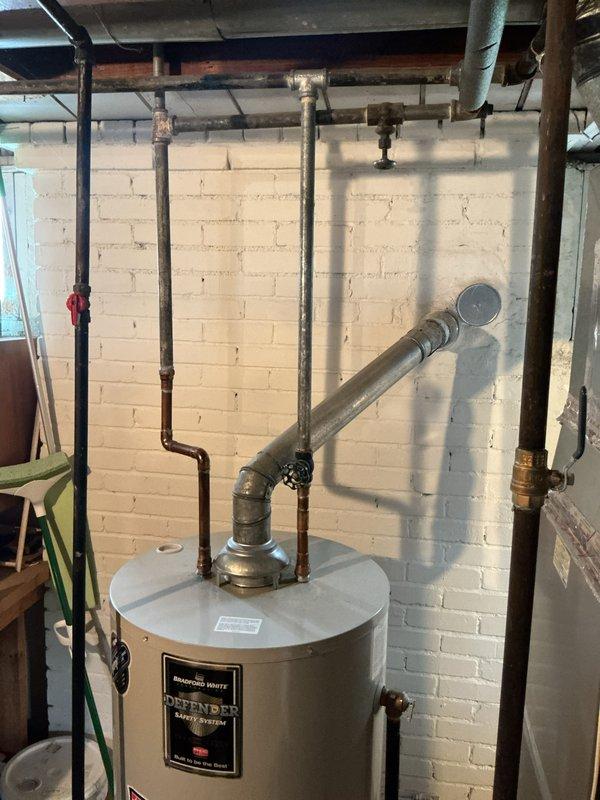 Diagnosed intermittent pilot light failure on 8-year-old Bradford White Defender water heater. Cleaned thermocouple and pilot assembly, adjusted gas pressure to manufacturer specifications, and verified proper venting. System now maintaining stable pilot flame with consistent heating performance.