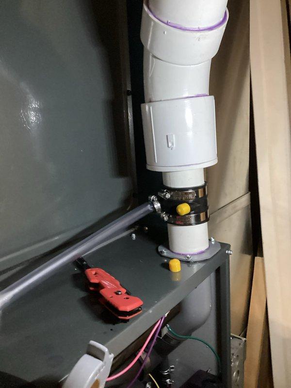 Completed annual heating maintenance on EnergiAir furnace (model WT 12-2027, manufactured in 2022). Inspected PVC condensate drainage system and verified proper installation of pipe connections with appropriate primer application and secure mounting. No issues found with the furnace components or associated plumbing connections.