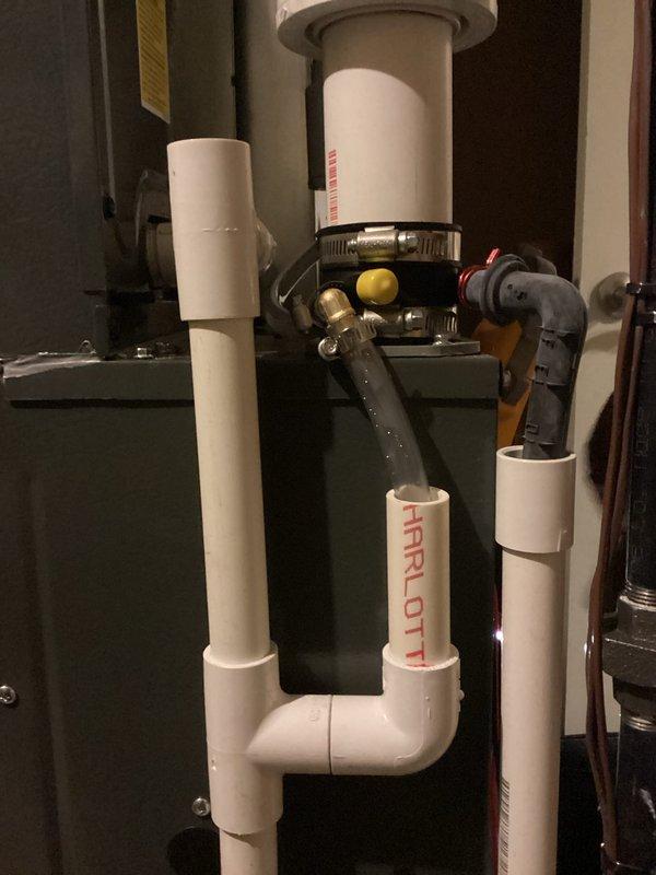 Completed annual heating maintenance on EnergiAir furnace (model WT 12-2027, manufactured in 2022). Inspected PVC condensate drainage system and verified proper installation of pipe connections with appropriate primer application and secure mounting. No issues found with the furnace components or associated plumbing connections.