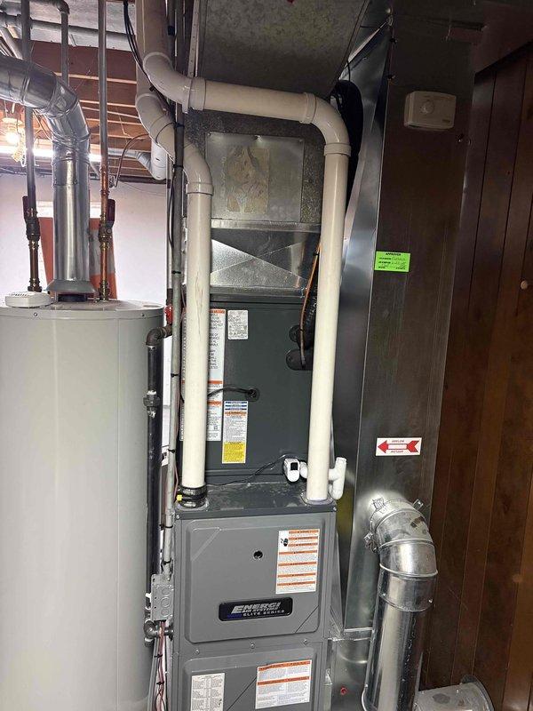 Successfully completed installation of new Amana air conditioning system, including outdoor condenser unit placed on concrete pad with proper line connections to the home. Interior work included connection to existing furnace system with appropriate ductwork modifications and PVC venting. All components were tested for proper operation and photo documentation was taken of both exterior and interior installations.