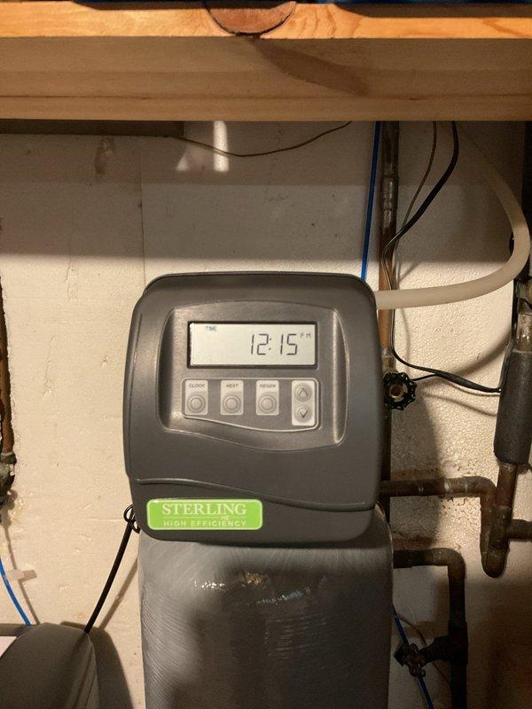 Successfully installed a Sterling High Efficiency water softener system with complete copper pipe integration in client's utility area. System was properly configured with digital control panel and connected to existing plumbing with all necessary valves. Salt tank was filled with appropriate media and system was tested to ensure proper function for the client's medical requirements.