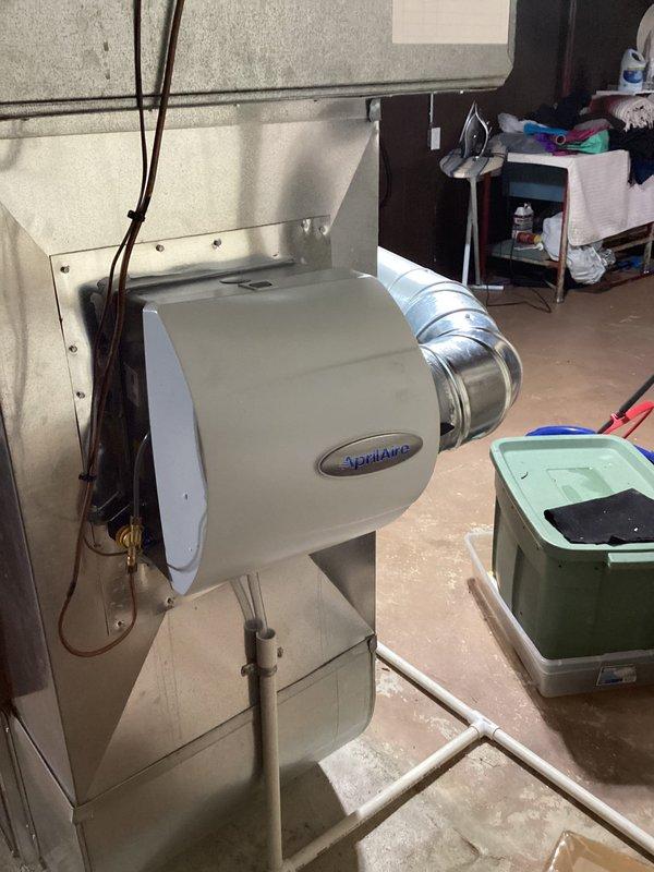 Completed annual heating tune-up on 13-year-old EnergiAir furnace as part of Comfort Club membership. Inspected and verified proper operation of the Aprilaire humidifier installed on the system. Equipment appears to be in normal working condition with no visible issues in the furnace, ductwork, or drainage components.