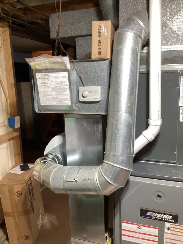 Completed annual heating tune-up on 13-year-old EnergiAir furnace as part of Comfort Club membership. Inspected and verified proper operation of the Aprilaire humidifier installed on the system. Equipment appears to be in normal working condition with no visible issues in the furnace, ductwork, or drainage components.